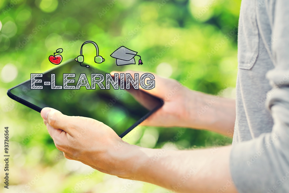 E-Learning concept with young man holding his tablet computer