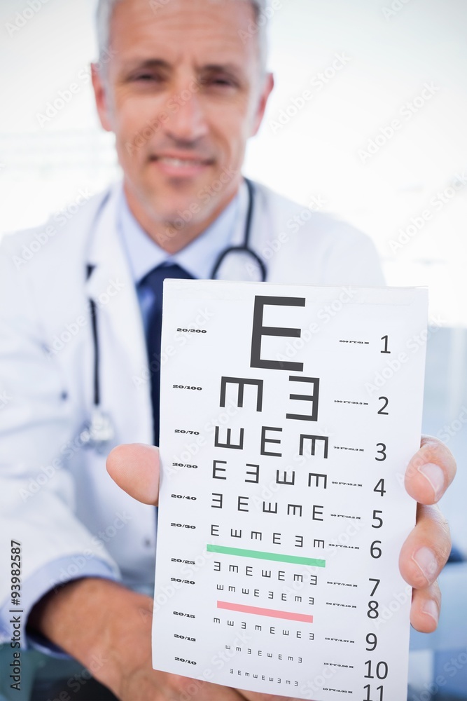 Composite image of male doctor showing sheet