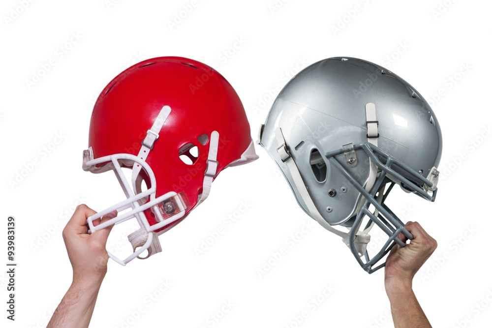 Composite image of american football player handing his helmet