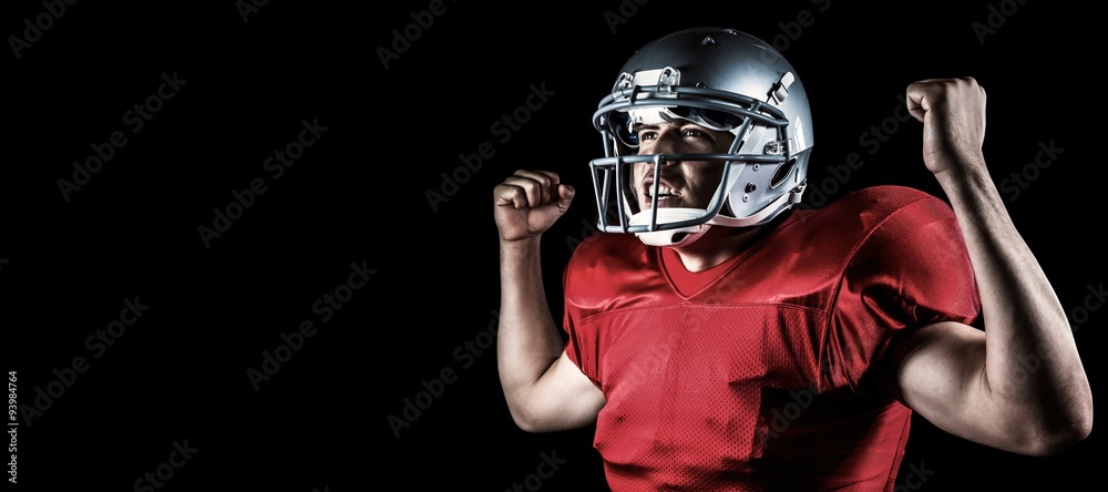 Composite image of happy sportsman cheering with clenched fist