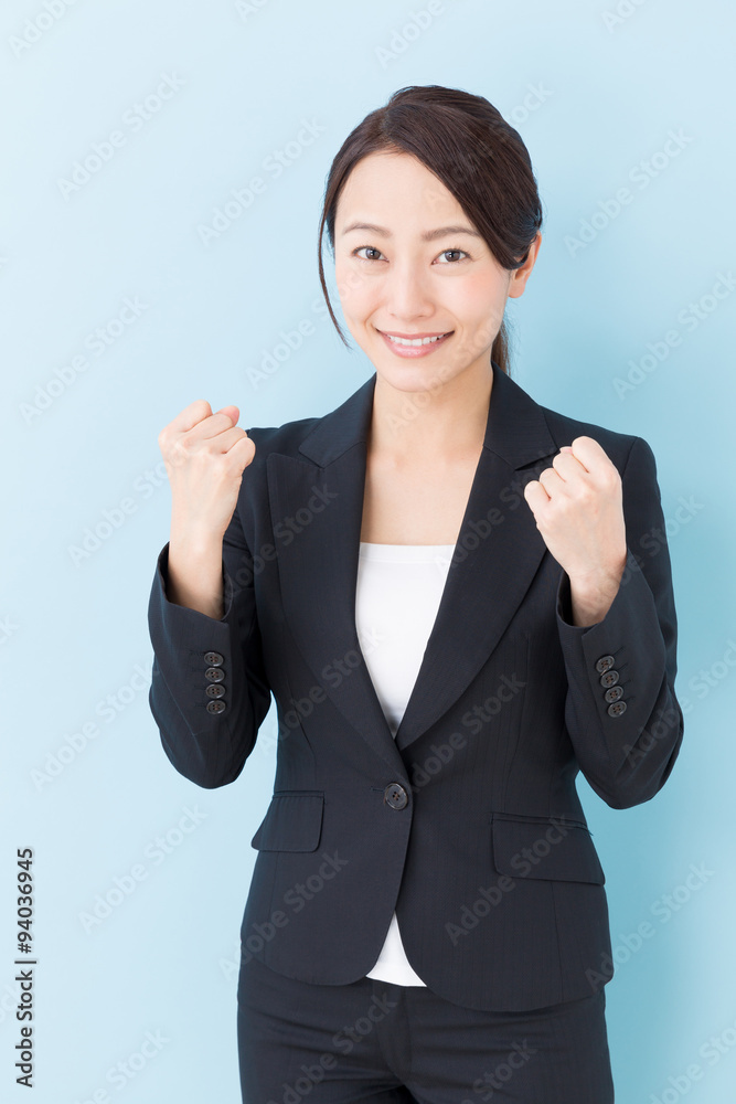 portrait of asian businesswoman on blue background