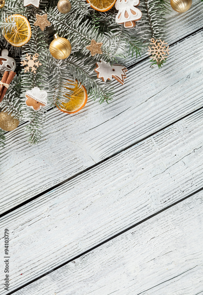 Christmas fir tree with decoration on a wooden board