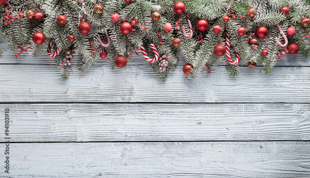 Christmas fir tree with decoration on a wooden board