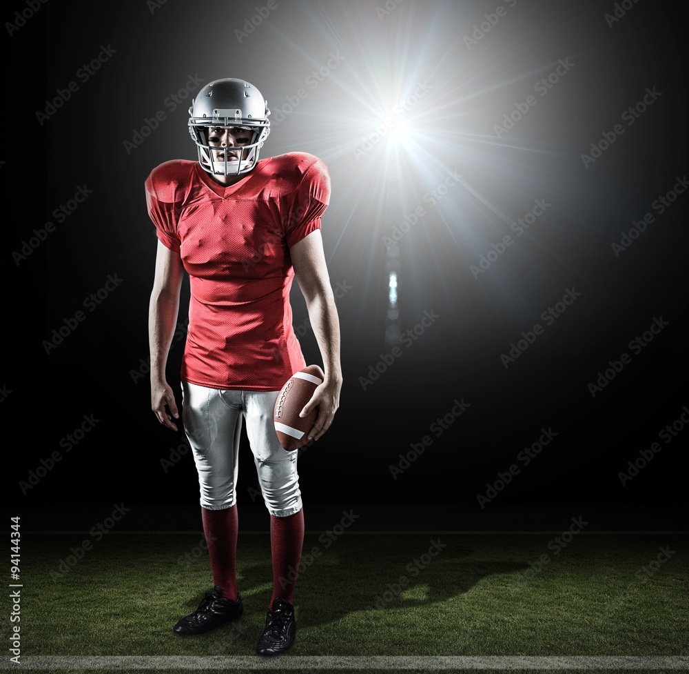 Composite image of portrait of sportsman with american football