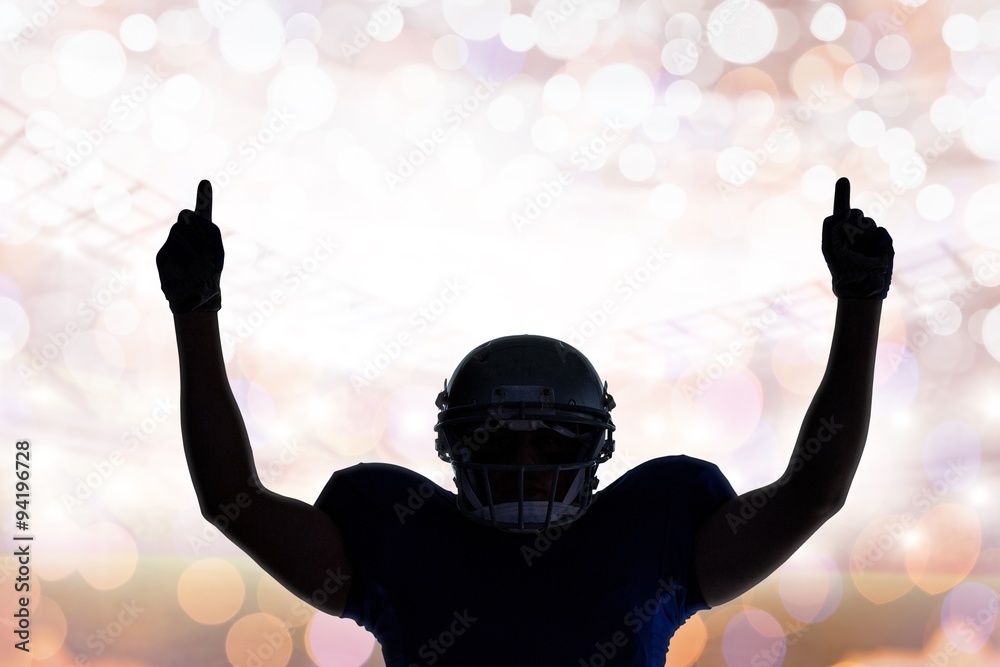 Composite image of silhouette american football player