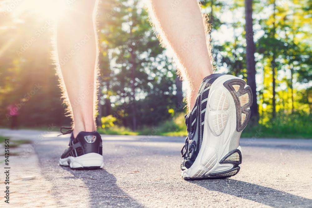 Athlete young male jogging outside