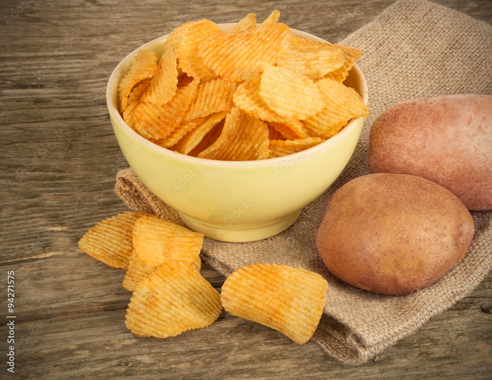 potato chips in a wooden bowl