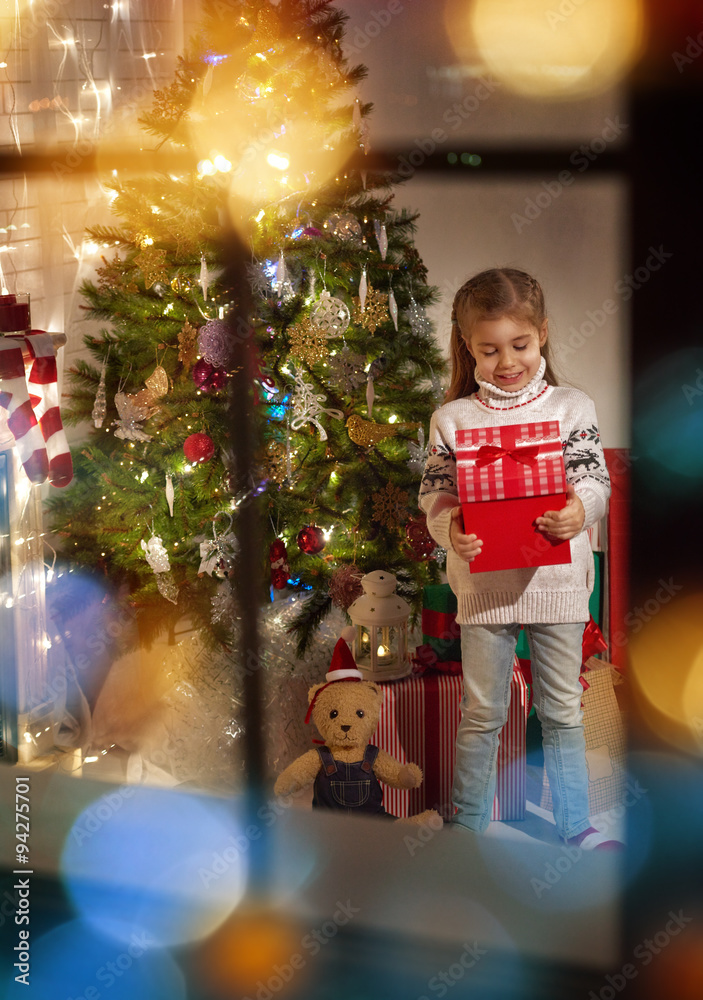 girl holding Christmas gift