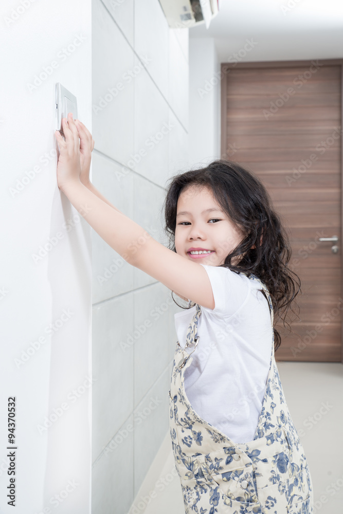 Environmental Issues concept - Asian little girl turn off/on swi