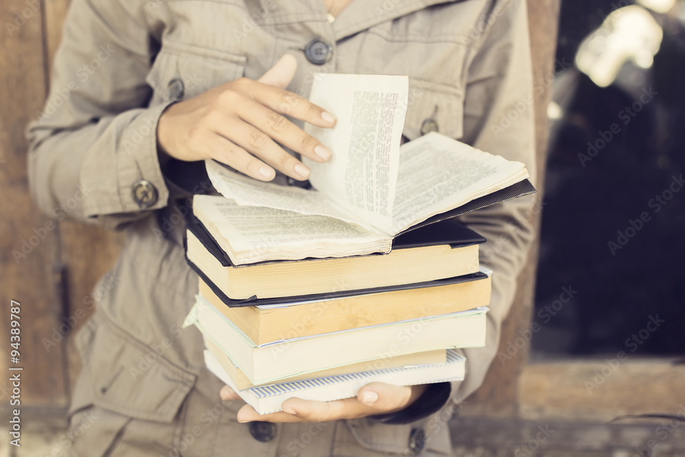 Girl reading a books outdoors