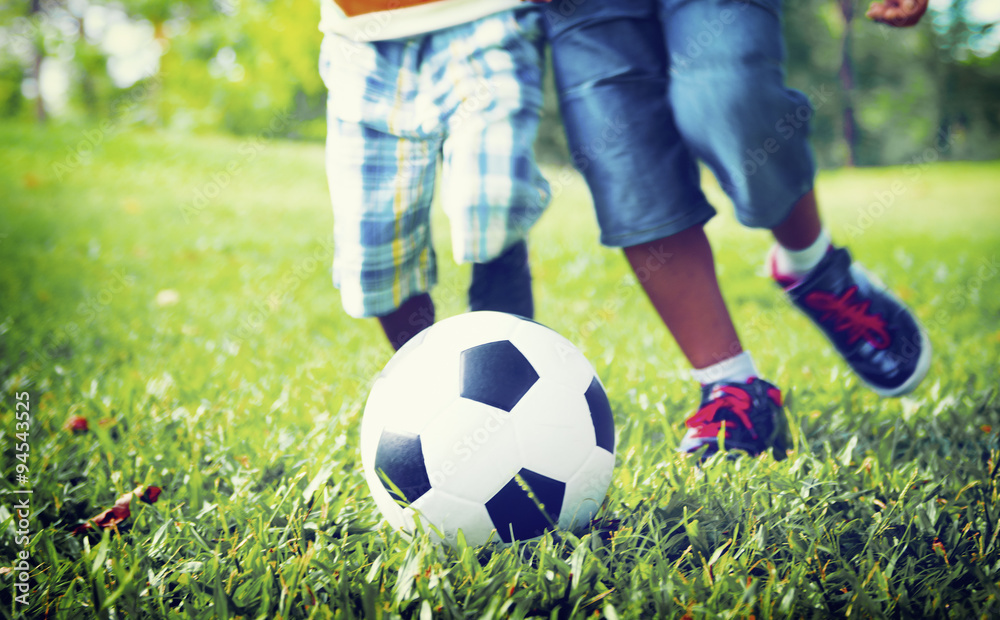 African Brother Playing Football Outdoors Concept