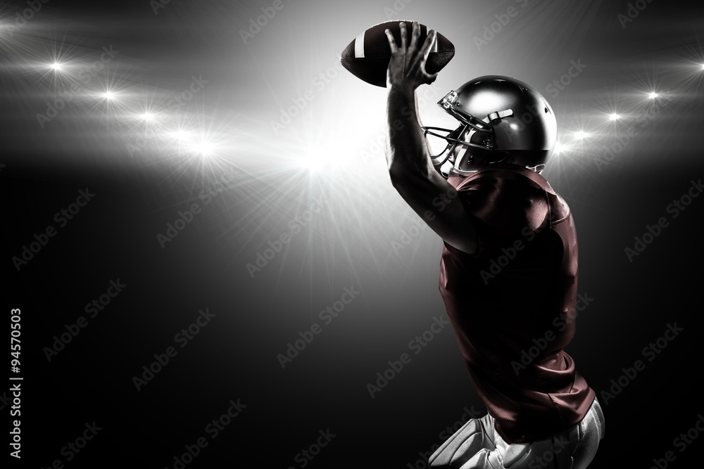 Composite image of sports player in red jersey holding ball