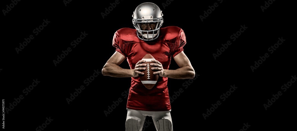 Composite image of  american football player holding ball