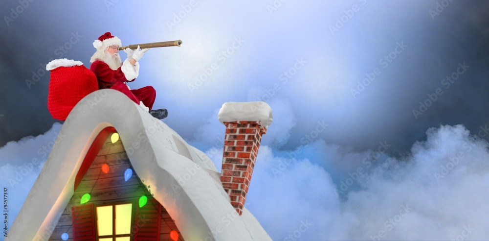 Composite image of santa sitting on roof of cottage