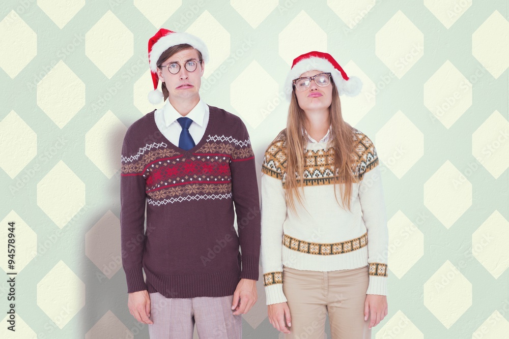 Composite image of sad geeky hipster couple