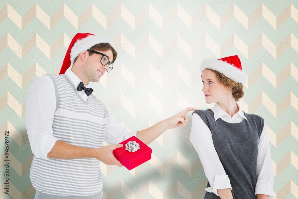 Composite image of hipster offering present to girlfriend