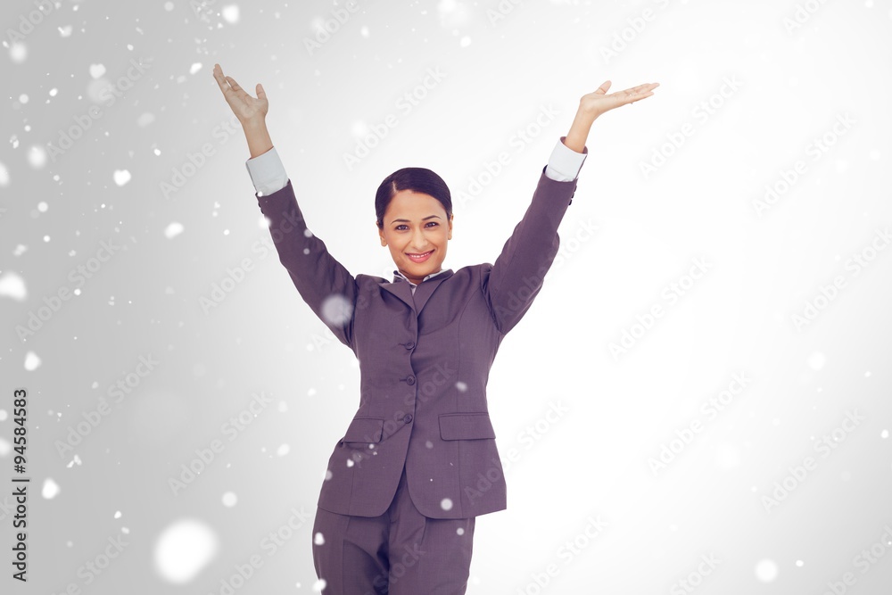 Composite image of cheering businesswoman