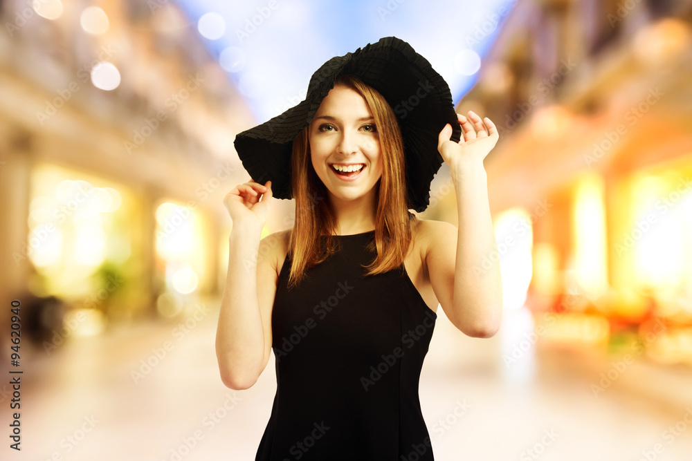 Happy young woman in a black