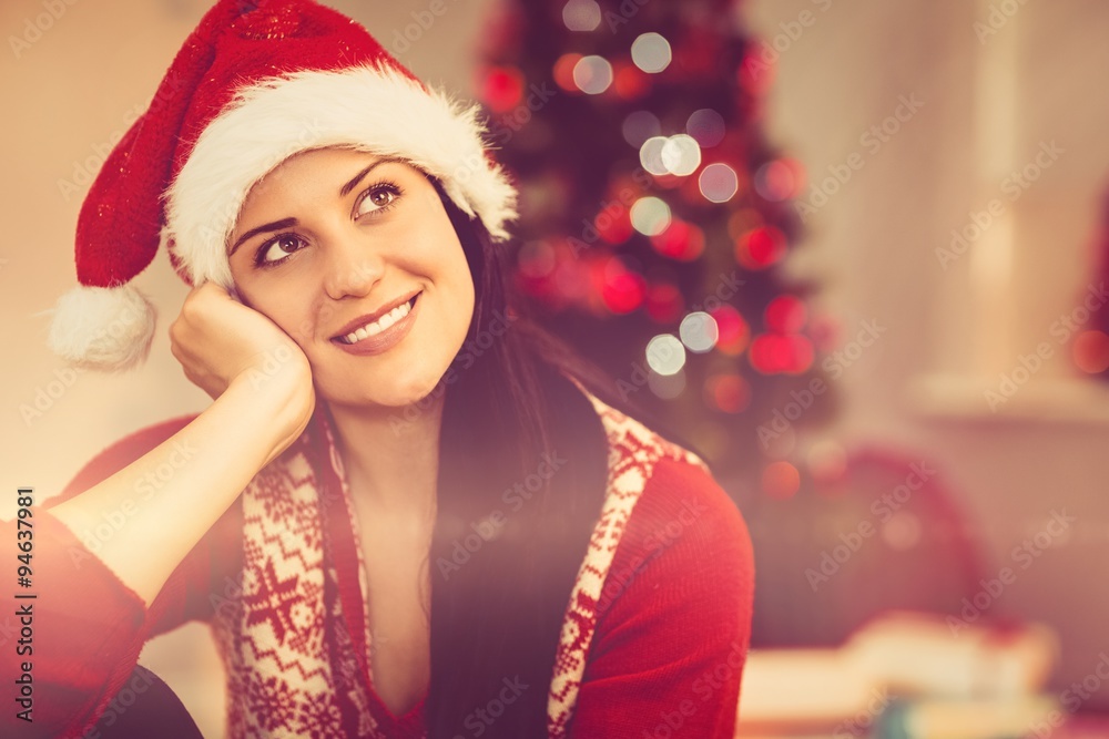 Festive brunette wearing a santa hat