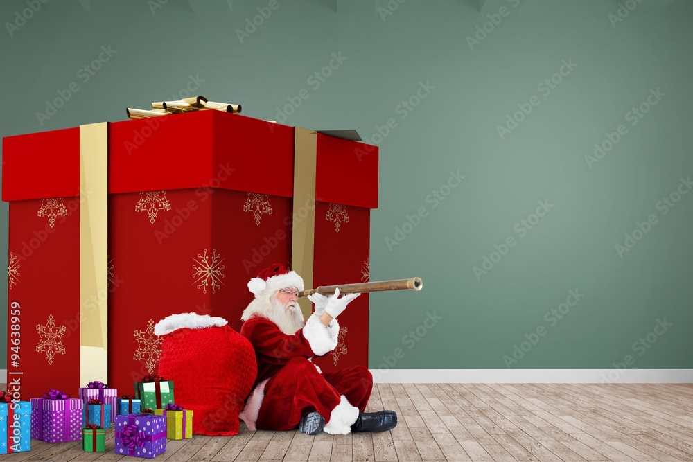 Composite image of santa looking through a telescope