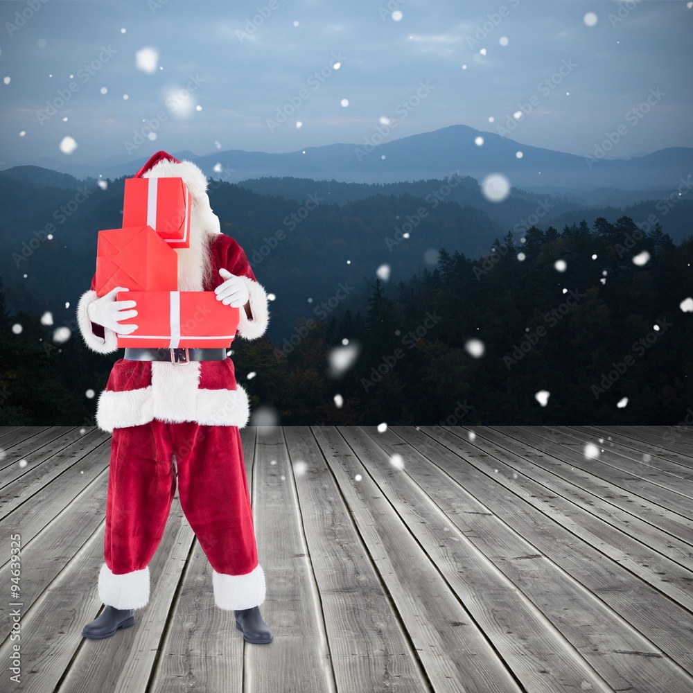 Composite image of santa carrying gifts