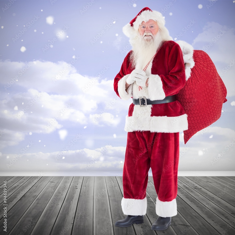 Composite image of santa smiling at camera