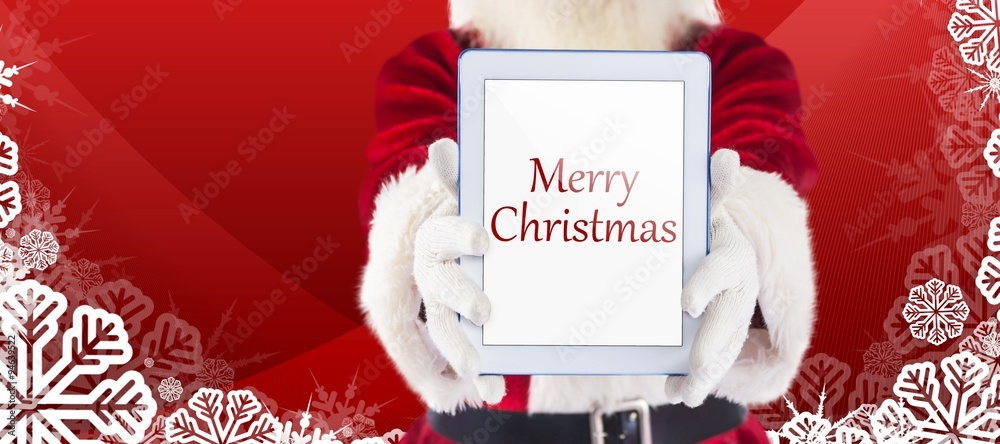 Composite image of santa presents a tablet pc