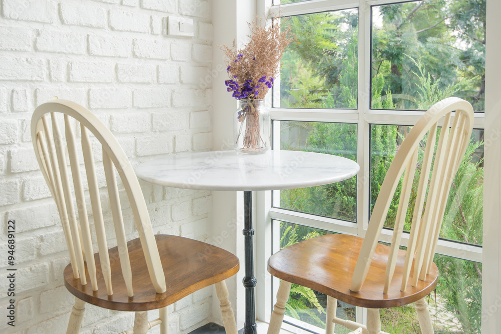 Vintage chair and table and window sill in background