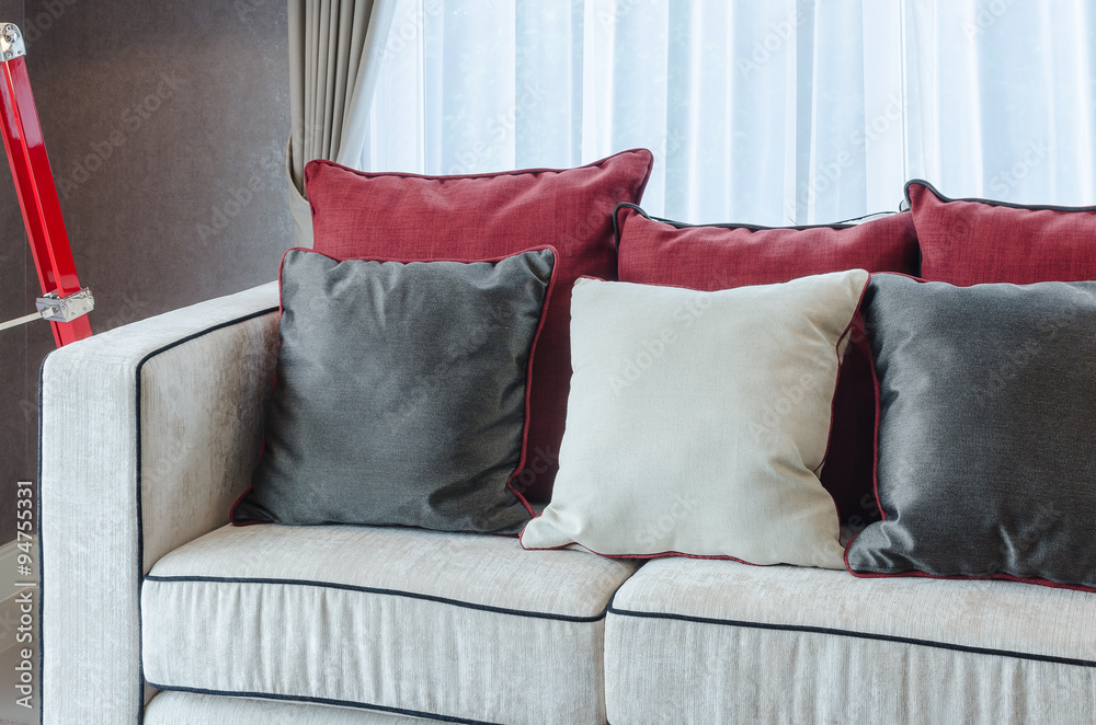 red and grey pillows on luxury sofa in living room