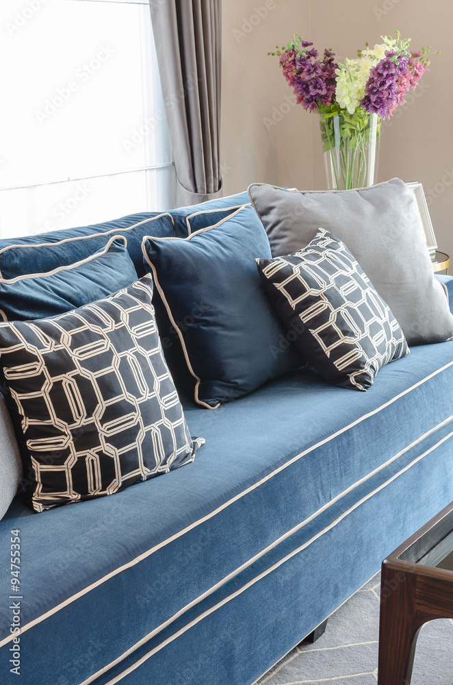 black and white pillows on classic blue sofa in living room