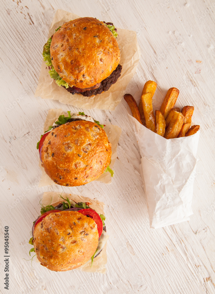 Delicious hamburgers on wood