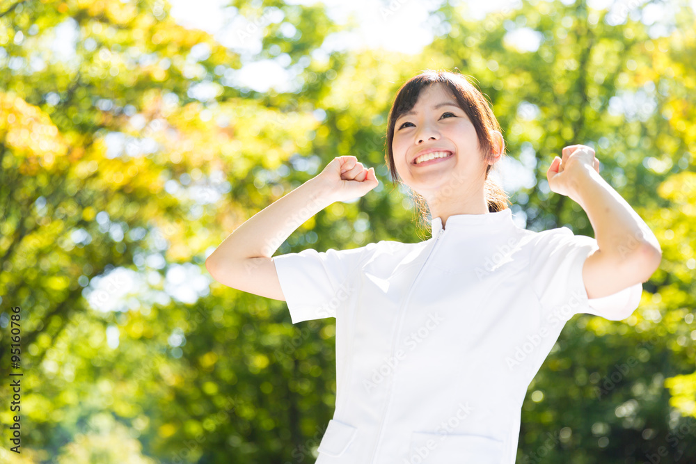 young asian nurse in the park