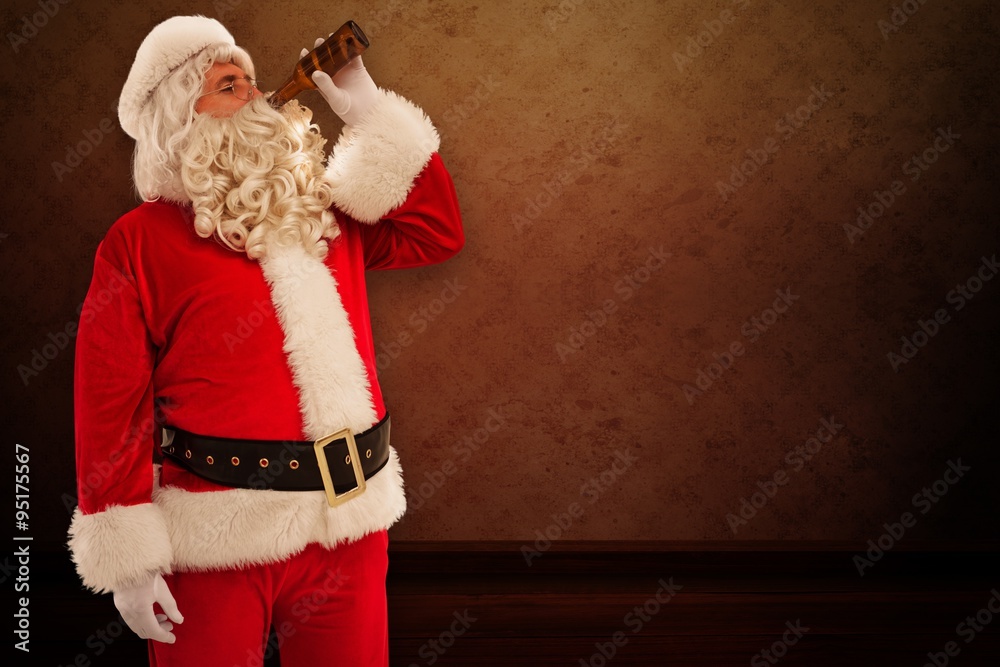 Composite image of father christmas drinking a beer