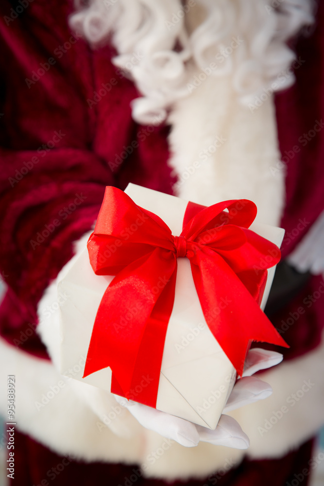 Santa Claus holding gift box