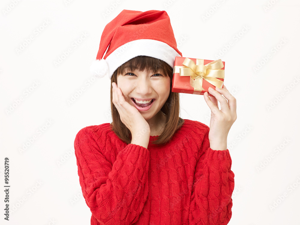 サンタ帽子を被る女性　クリスマスプレゼント