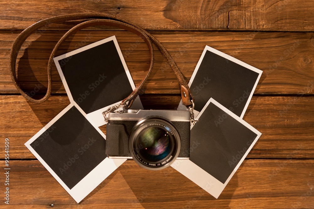 Instant photos on wooden floor