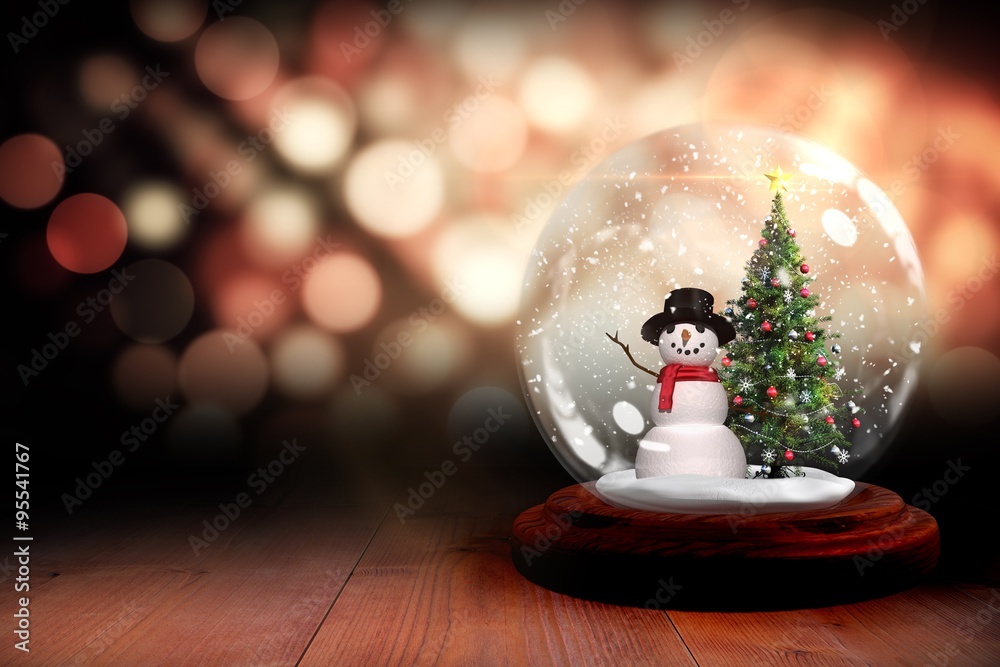 Christmas tree and snowman in snow globe