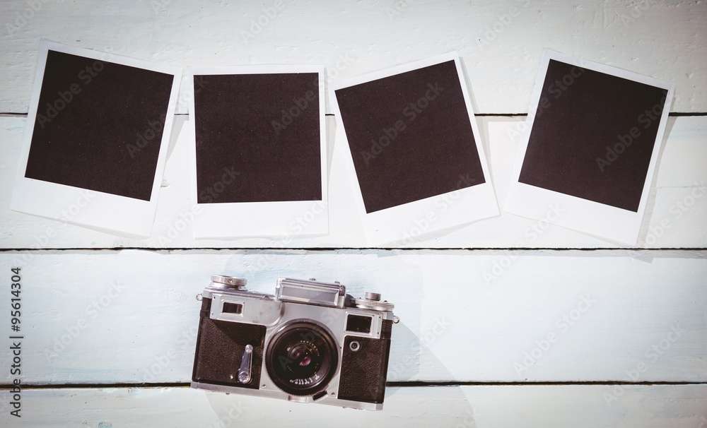 Instant photos on wooden floor