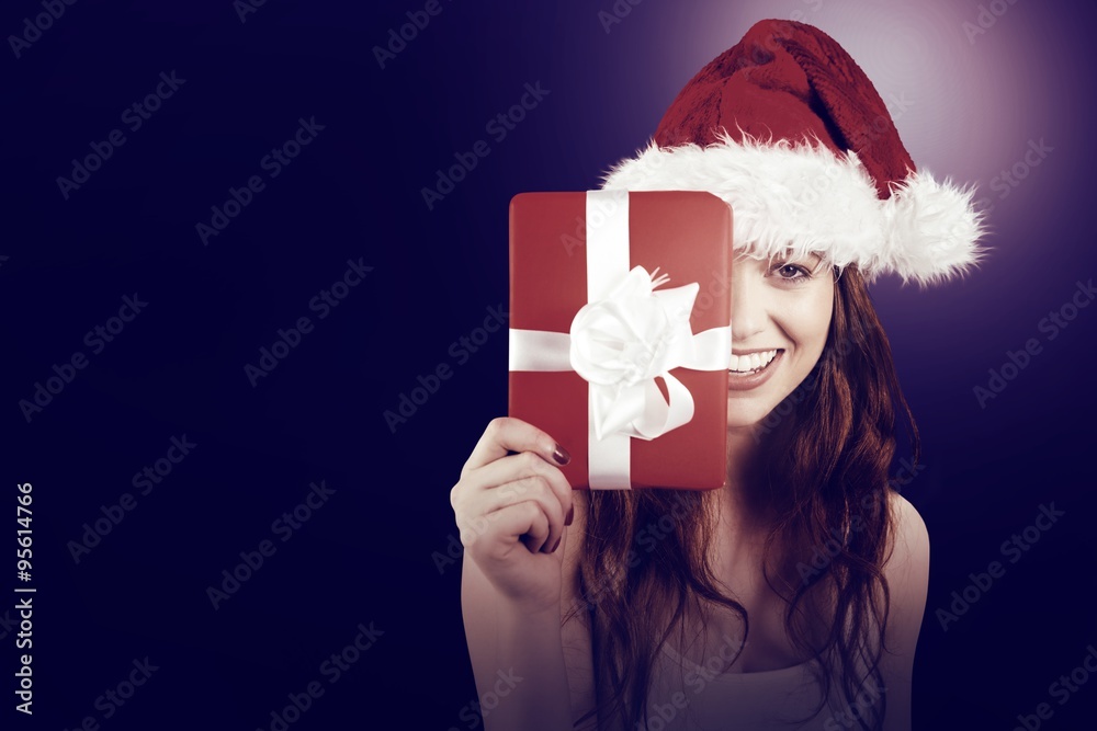 Festive redhead holding a gift