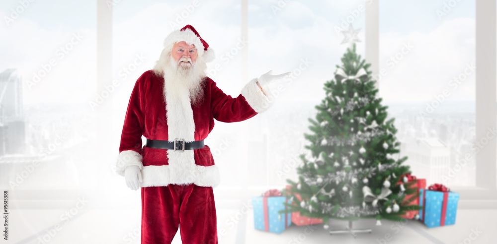 Composite image of santa shows something to camera