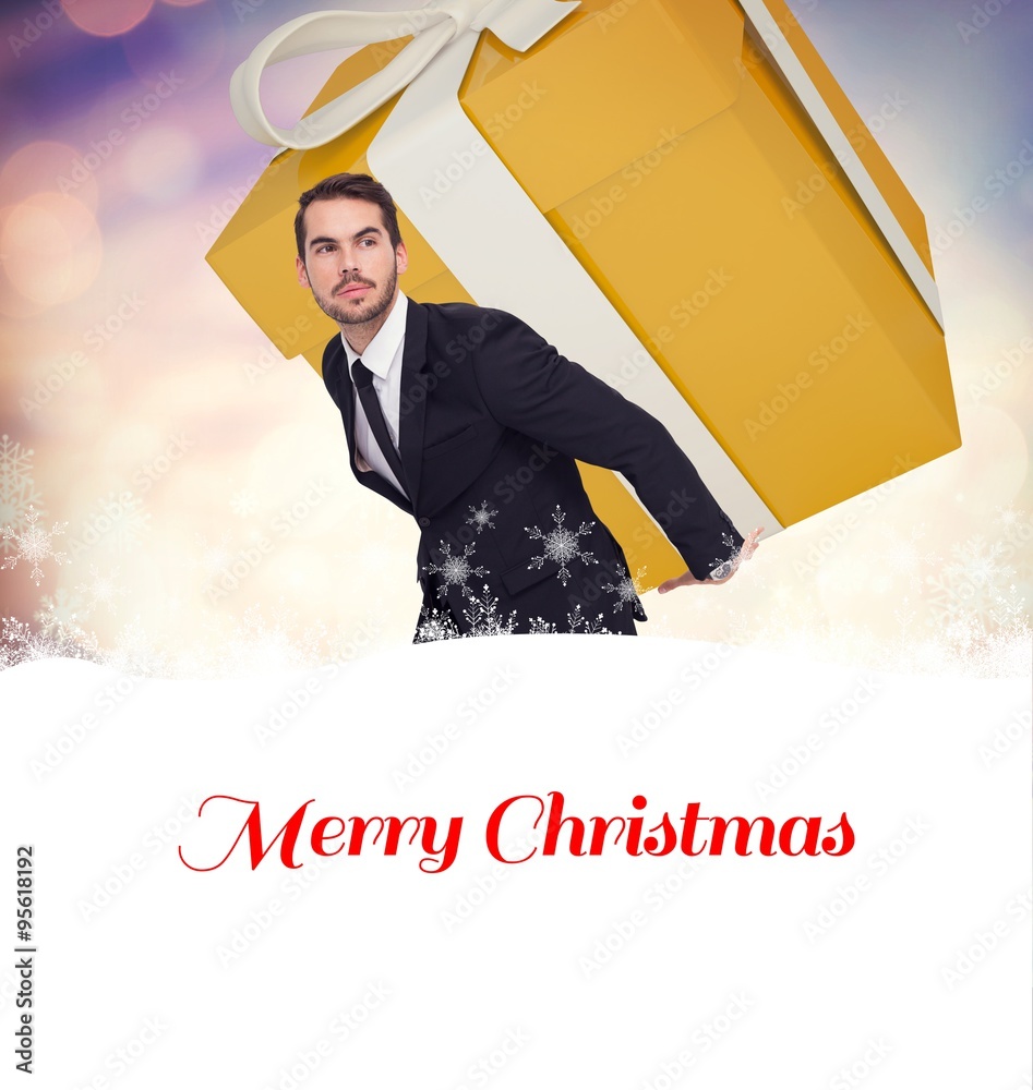 Composite image of stylish man with giant gift