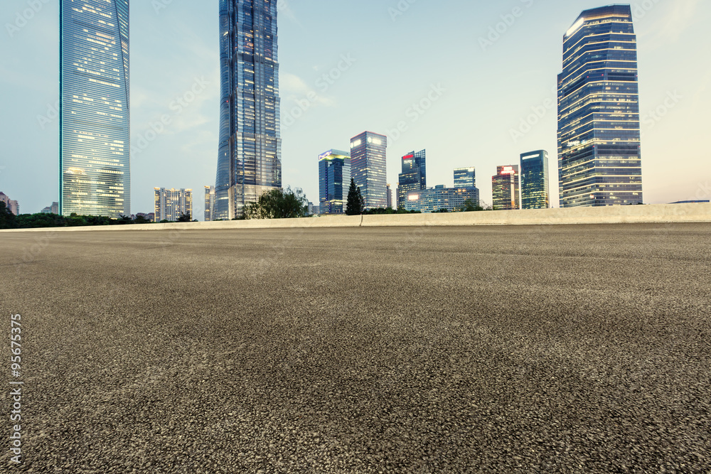 Asphalt road in front of the modern city Shanghai, China