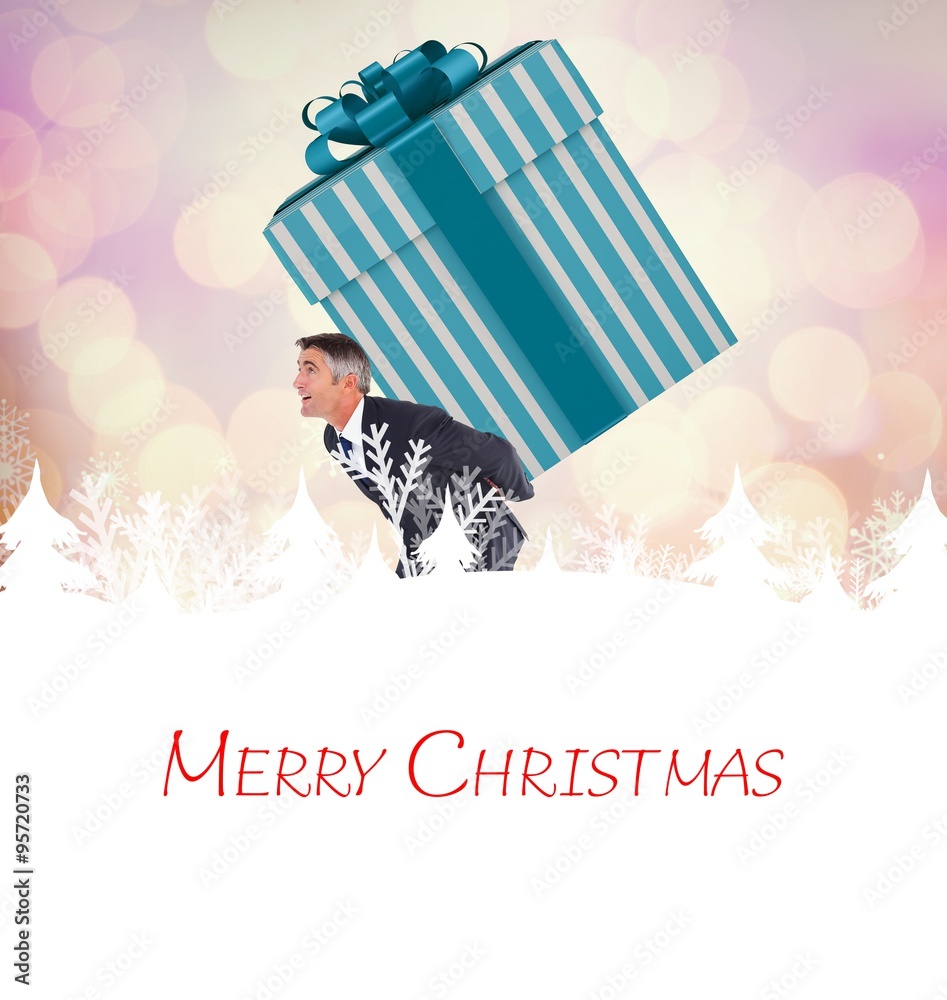 Composite image of stylish man with giant gift