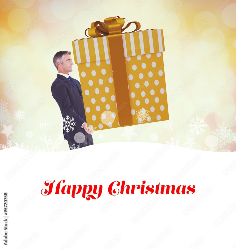 Composite image of stylish man with giant gift