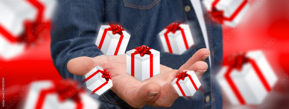 Man celebrating christmas holding gift in his hand