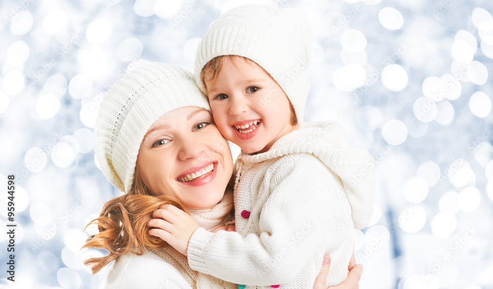 happy family mother and child baby daughter on a winter walk