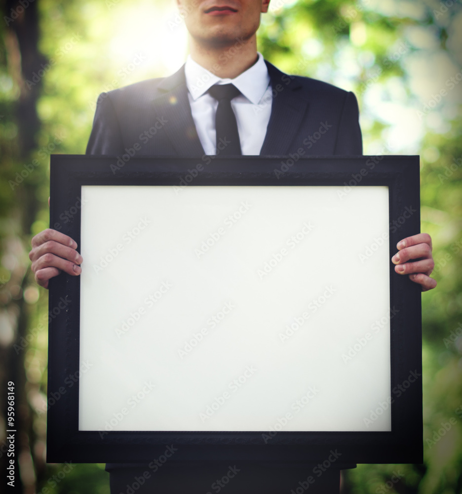 Businessman Holding Picture Frame Copy Space Concept