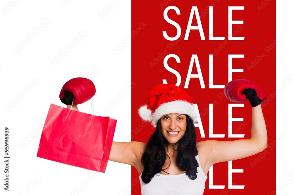 Composite image of woman wearing red boxing gloves