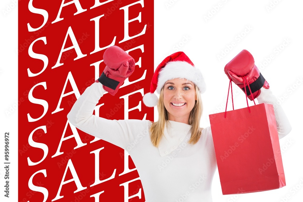 Festive blonde in boxing gloves with shopping bag