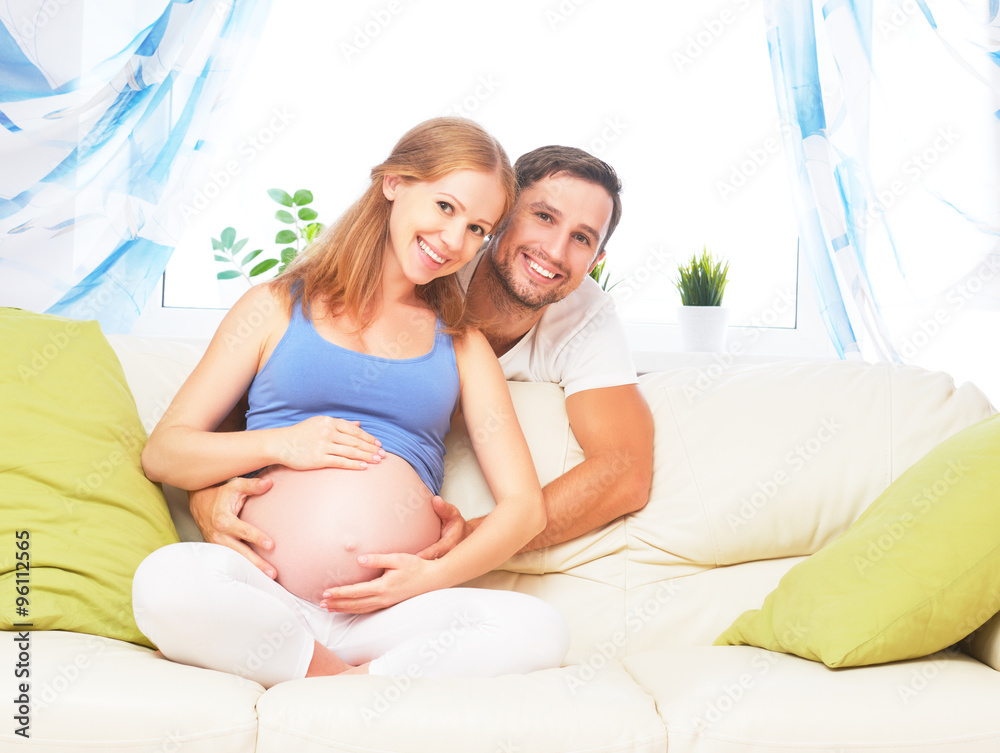 happy family in anticipation of birth of baby. Pregnant woman an